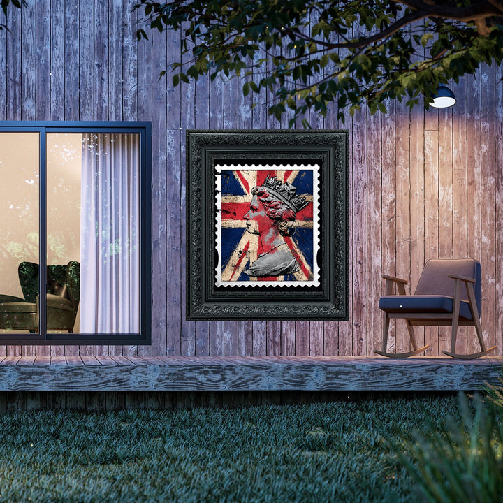 Framed artwork of a stylized portrait with a Union Jack background on a wooden wall.