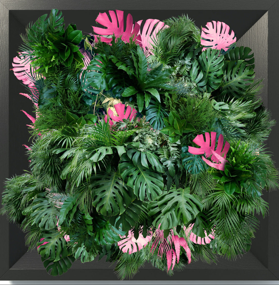 An acrylic print with a 3D effect featuring a variety of artificial foliage and purple flowers, designed to be mounted on a wall.