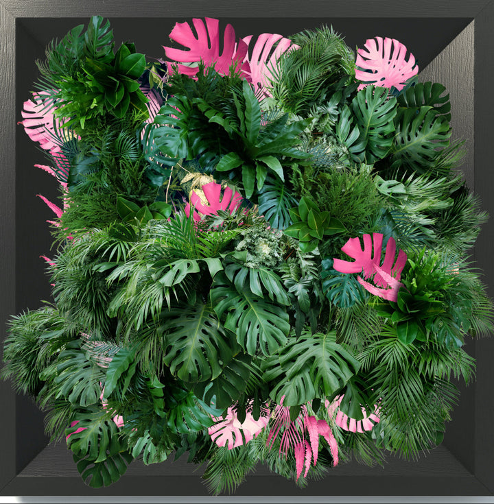 An acrylic print with a 3D effect featuring a variety of artificial foliage and purple flowers, designed to be mounted on a wall.