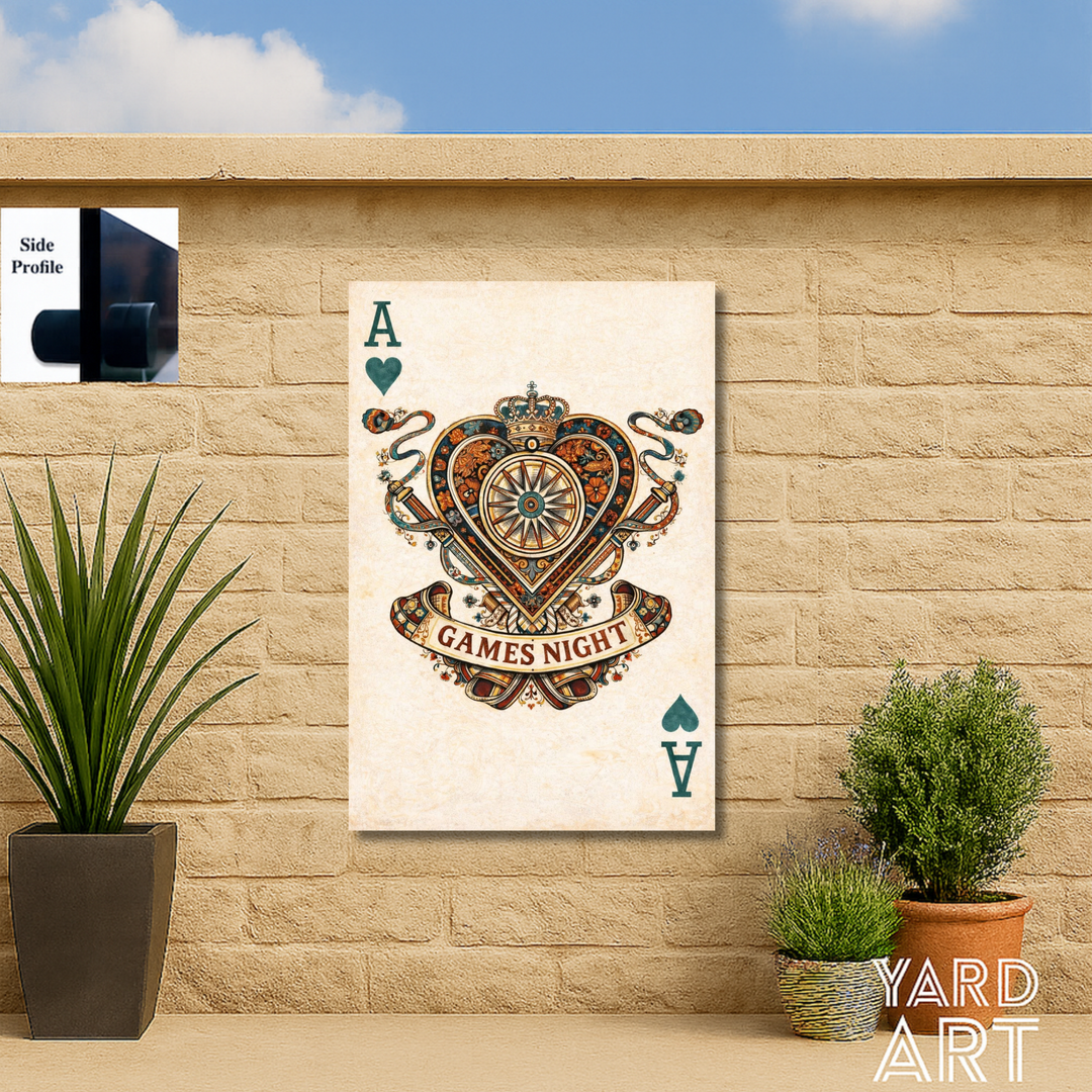 Decorative wall art with 'GAMES NIGHT' design on a stone wall with plants.