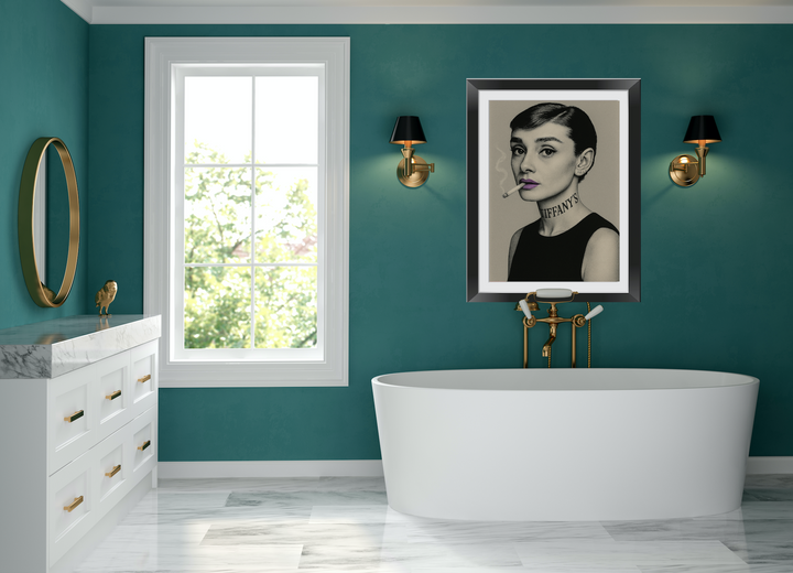 Modern Audrey Hepburn bathroom art with teal walls, white bathtub, and artwork.