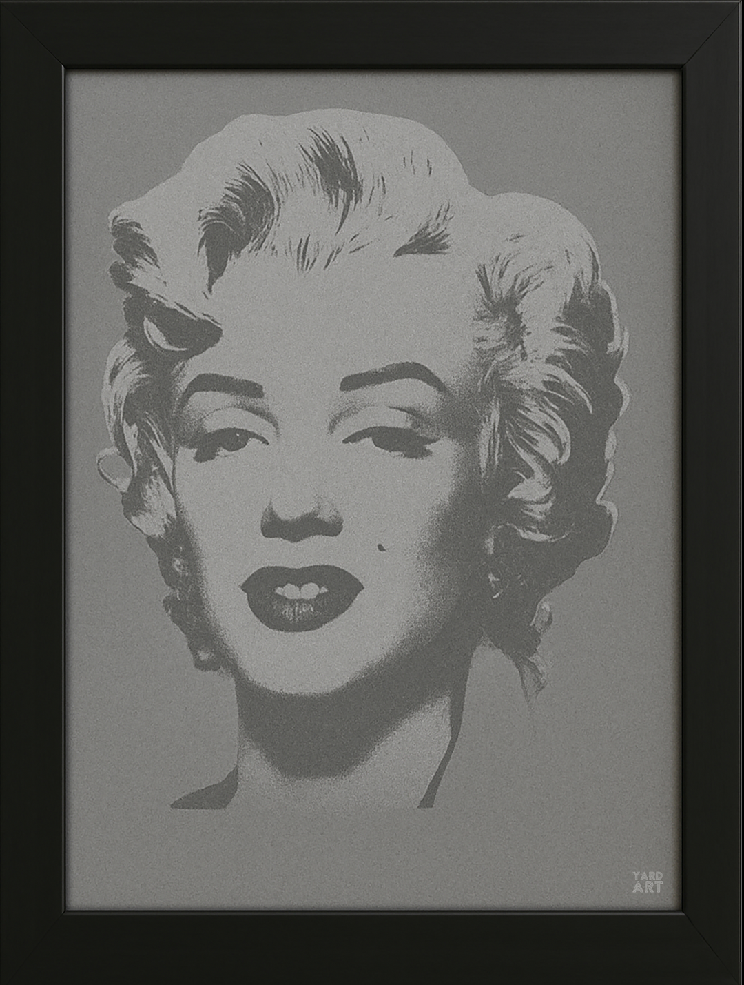 Framed artwork of a stylized portrait on a gray background