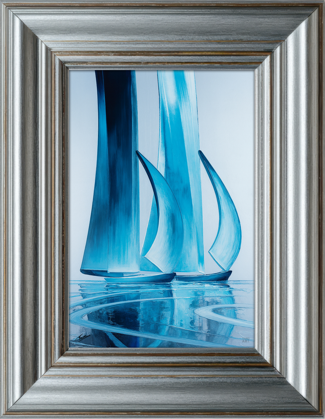 Framed artwork of blue glass  resembling sailboats on a white background
