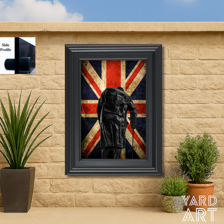 Framed artwork of Winstonurchill with a cane against a Union Jack background on a stone wall.